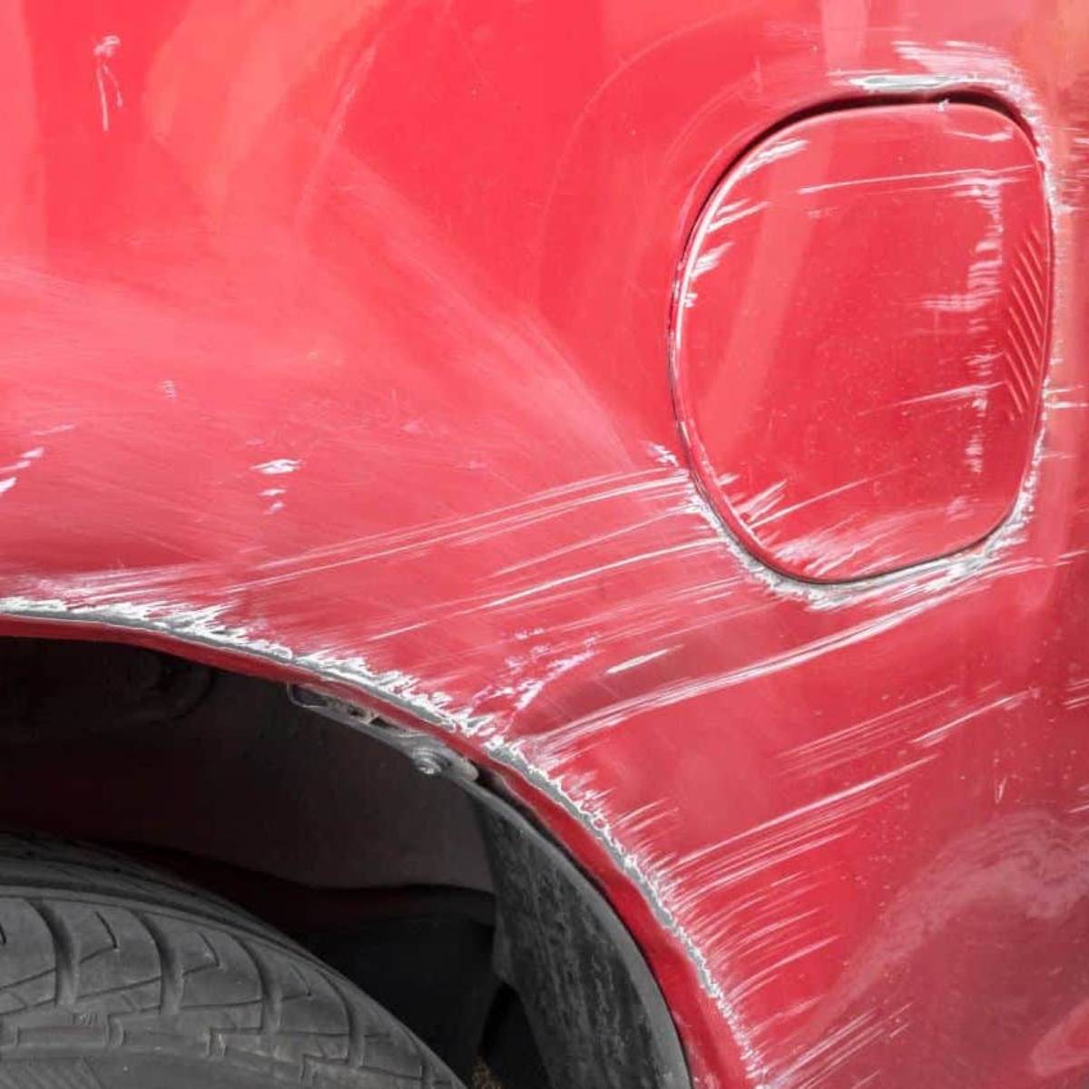Red panel sanded for body work