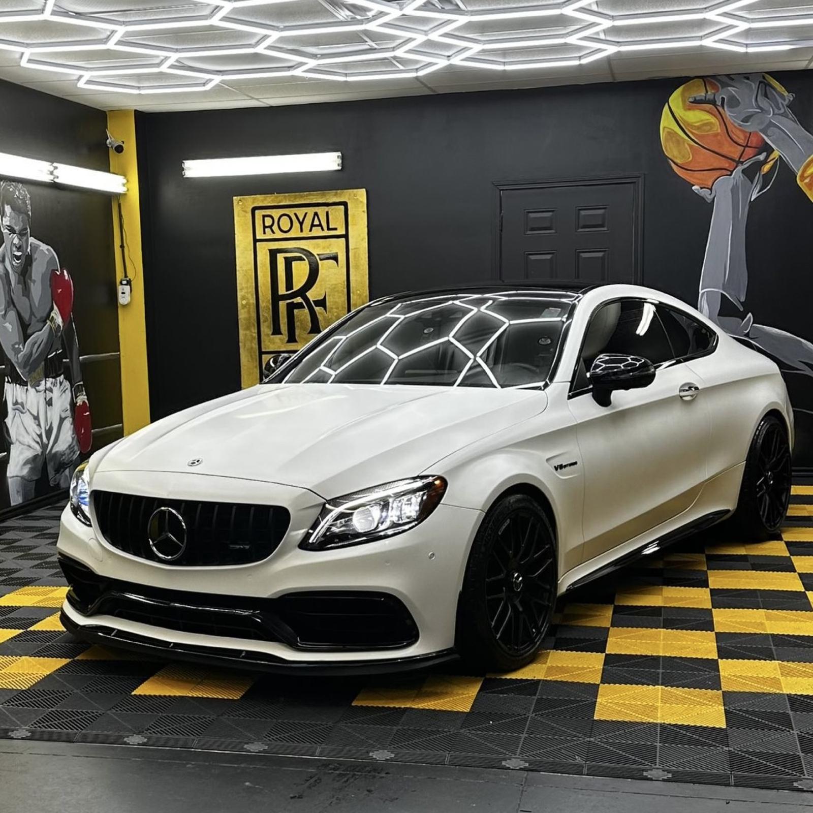 White AMG C63 coupe in the Royal Finish shop