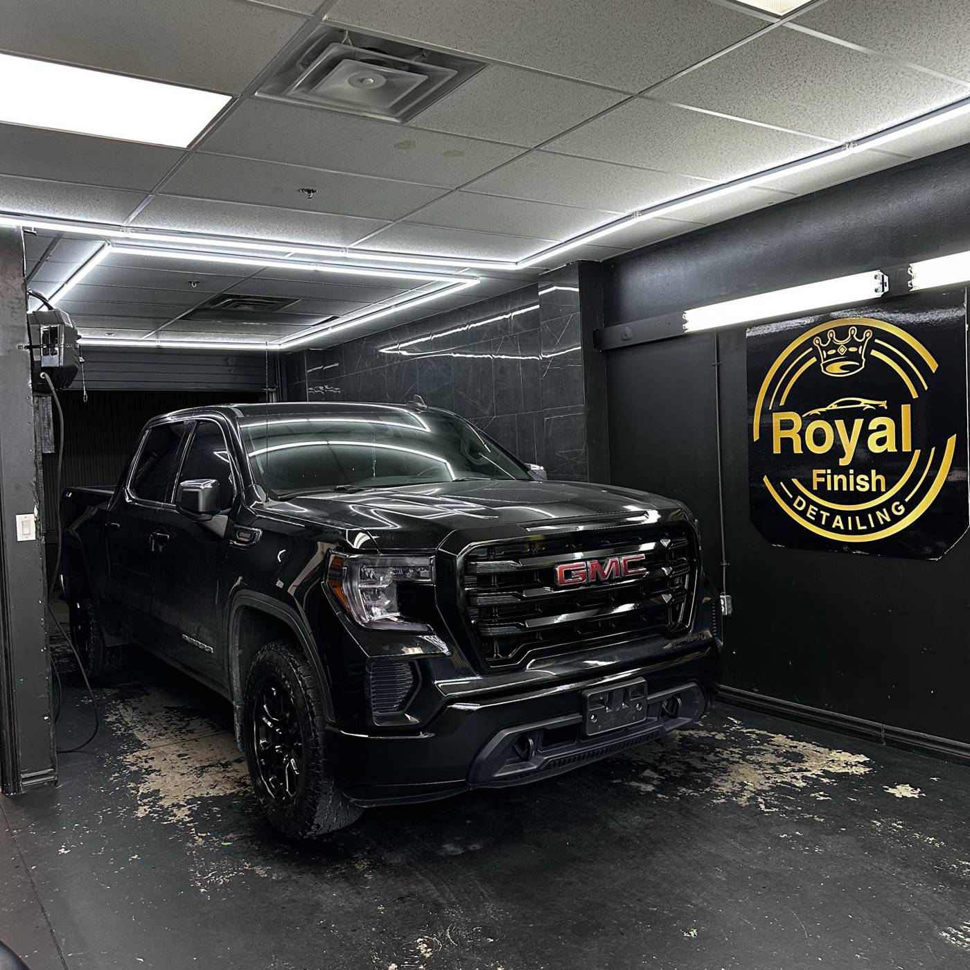 Black GMC Sierra in the shop